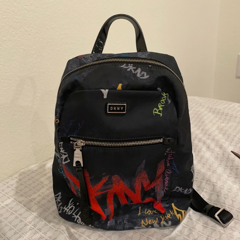 Dkny backpack used only a few times. Multi color majorly navy blue. Light wgt